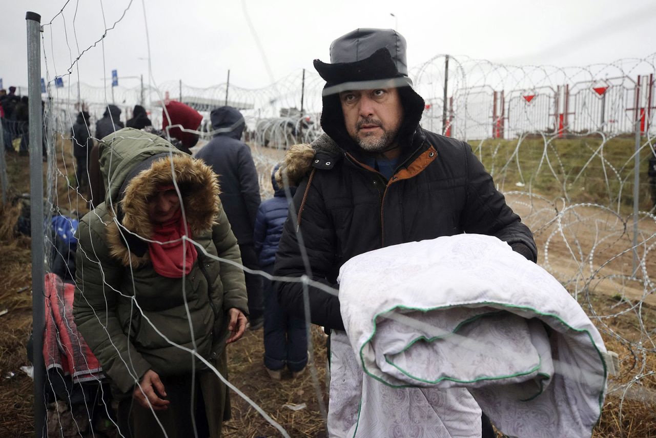 Migrants are seen near the border in the Grodno region of Belarus on Saturday, November 13.