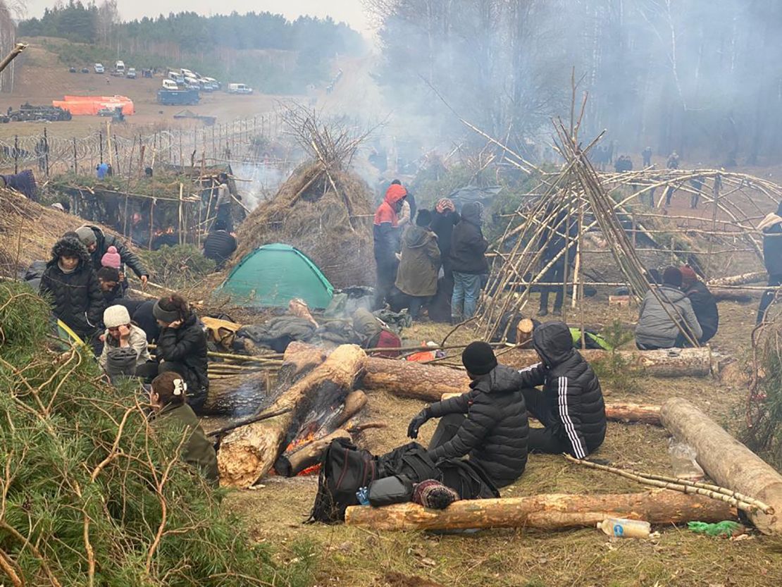 Razor wire erected by Poland along the border prevents the migrants camped out in the Belarusian forest from crossing.