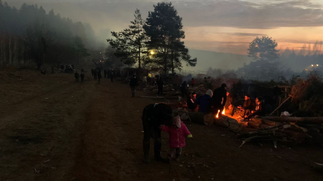 Smoky fires fill the forest on the Belarus-Poland border as people seek to stay warm.