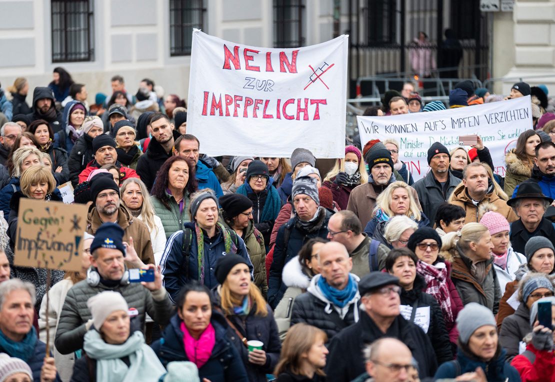 A demonstrator holds a placard reading "No to compulsory vaccination" during an anti-vaccination protest at the Ballhausplatz in Vienna, Austria, on November 14.