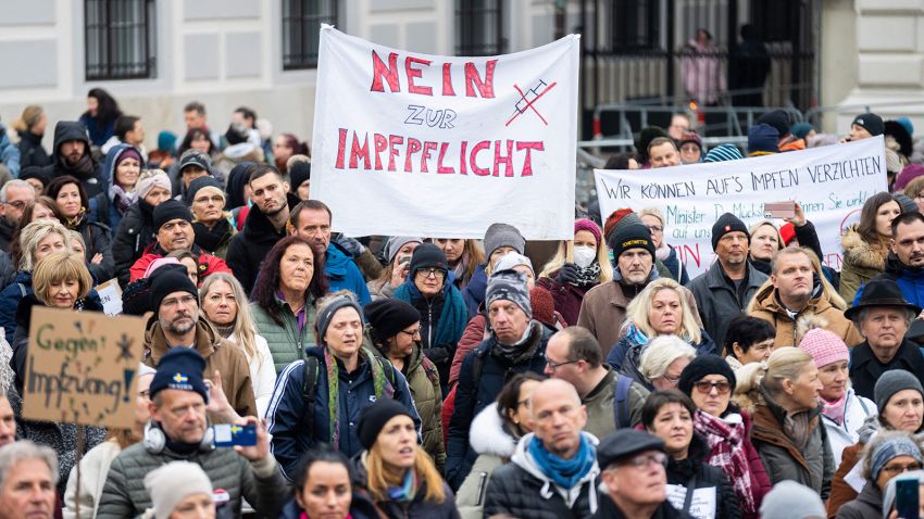 A demonstrator holds a placard reading 'No to compulsory vaccination' during an anti-vaccination protest at the Ballhausplatz in Vienna, Austria, on November 14, 2021, after a Corona crisis' summit of the Austrian government. - Austrian Chancellor Alexander Schallenberg said on November 14, that a nationwide lockdown would begin on November 15, for those not vaccinated against Covid-19 or recently recovered, as the EU member fights a record surge in cases. - Austria OUT (Photo by GEORG HOCHMUTH / APA / AFP) / Austria OUT (Photo by GEORG HOCHMUTH/APA/AFP via Getty Images)