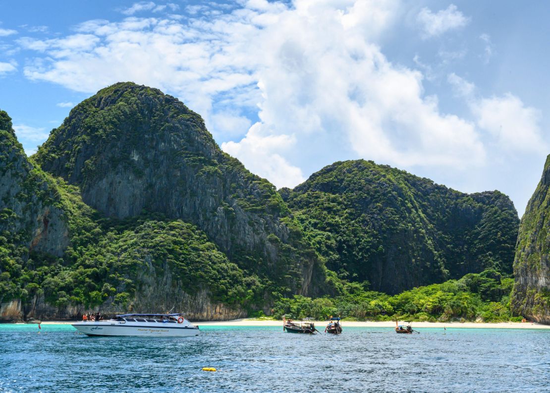 This picture taken on October 4, 2019 shows boats at the Maya Bay boundary line set by the Thai National Park, Wildlife and Plant Conservation Department. The beach is off limits. 