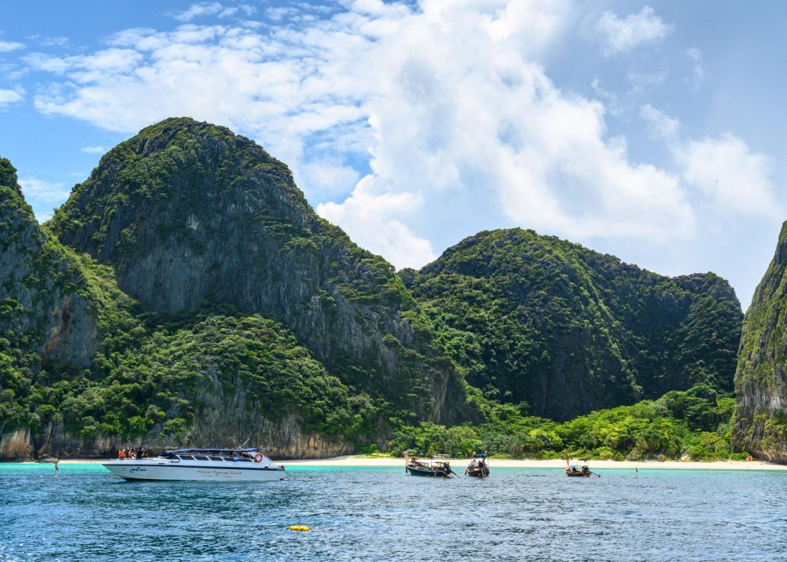 This picture taken on October 4, 2019 shows boats at the Maya Bay boundary line set by the Thai National Park, Wildlife and Plant Conservation Department. The beach is off limits.