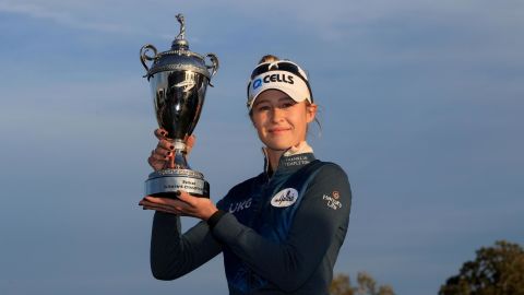 Nelly Korda poses with the trophy after winning the Pelican Women's Championship.