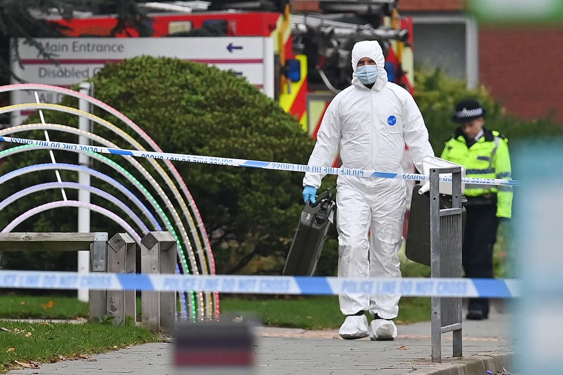 A specialist inspects the scene of the blast outside the Women's Hospital in Liverpool on Sunday. 