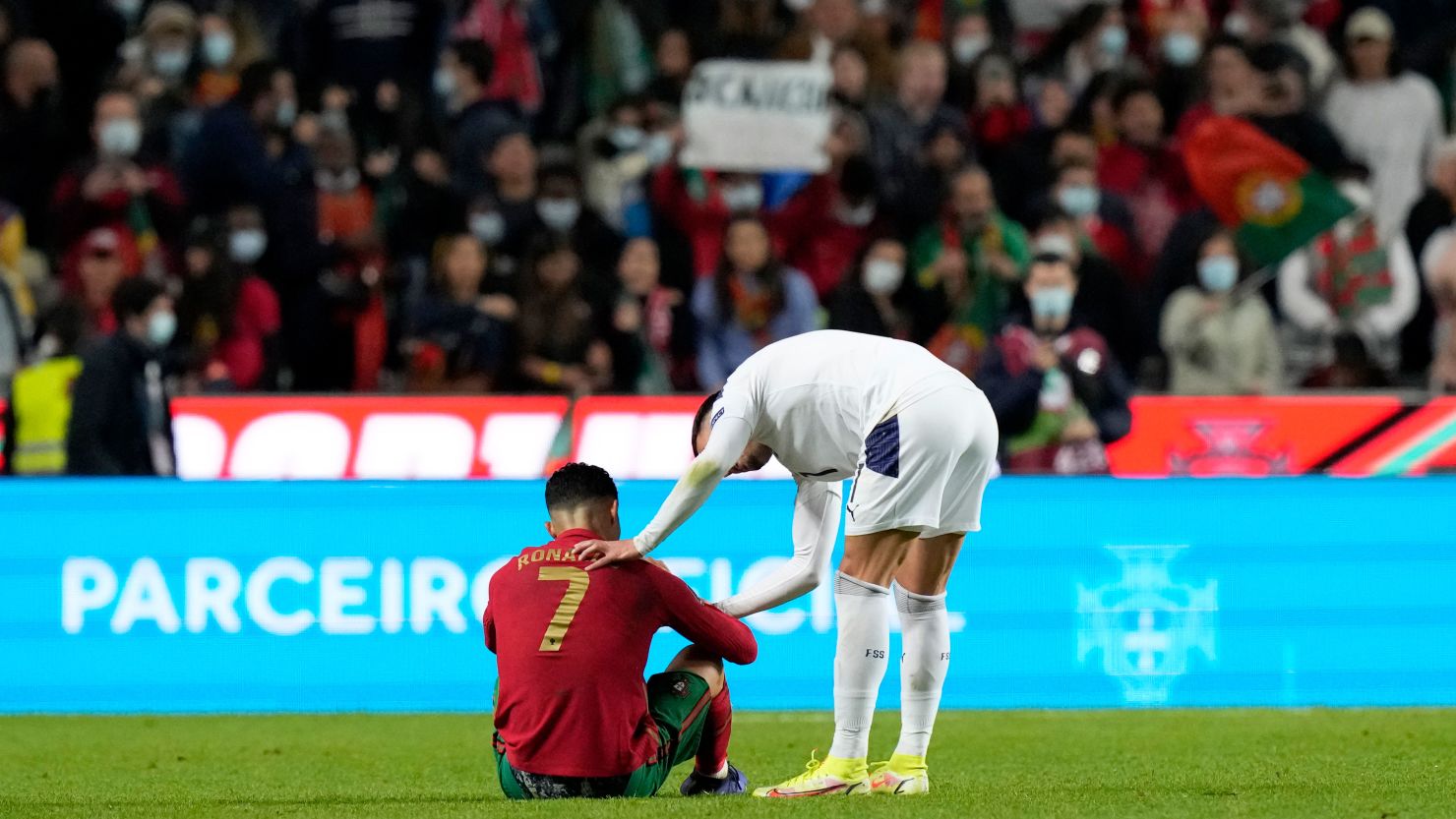 Cristiano Ronaldo is consoled by Filip Kostic after Portugal's defeat against Serbia. 