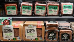 Packages of "Impossible Burger" and "Beyond Meat" sit on a shelf for sale on November 15, 2019 in New York City. 