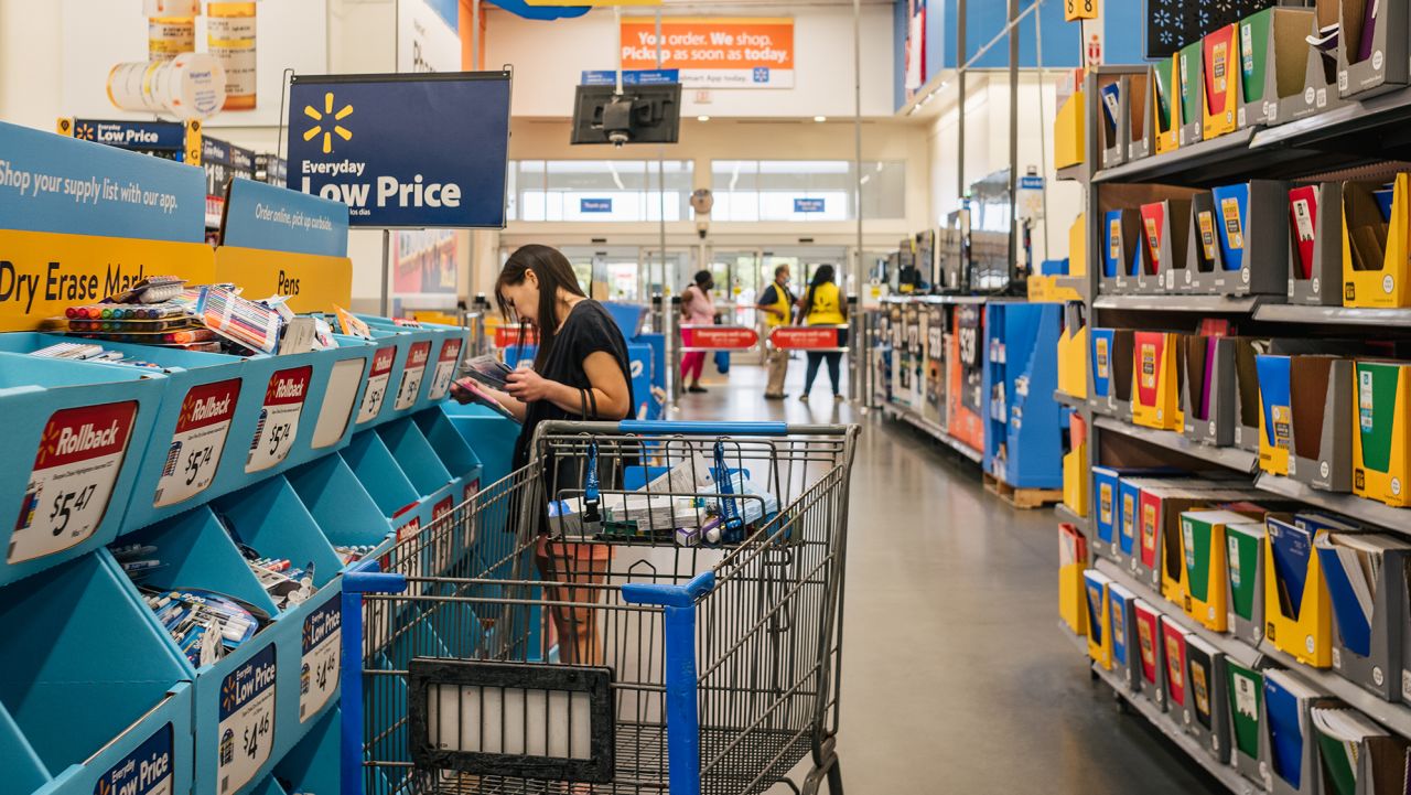 HOUSTON, TEXAS - AUGUST 04: A customer shops at a Walmart store on August 04, 2021 in Houston, Texas. The cost of back-to-school items is on the rise due to a combination of delays in U.S. manufacturing and heightened consumer demand for goods. The steep increases are partially due to both elementary and college-aged students returning back to school after missing in-person class sessions during the pandemic.  (Photo by Brandon Bell/Getty Images)