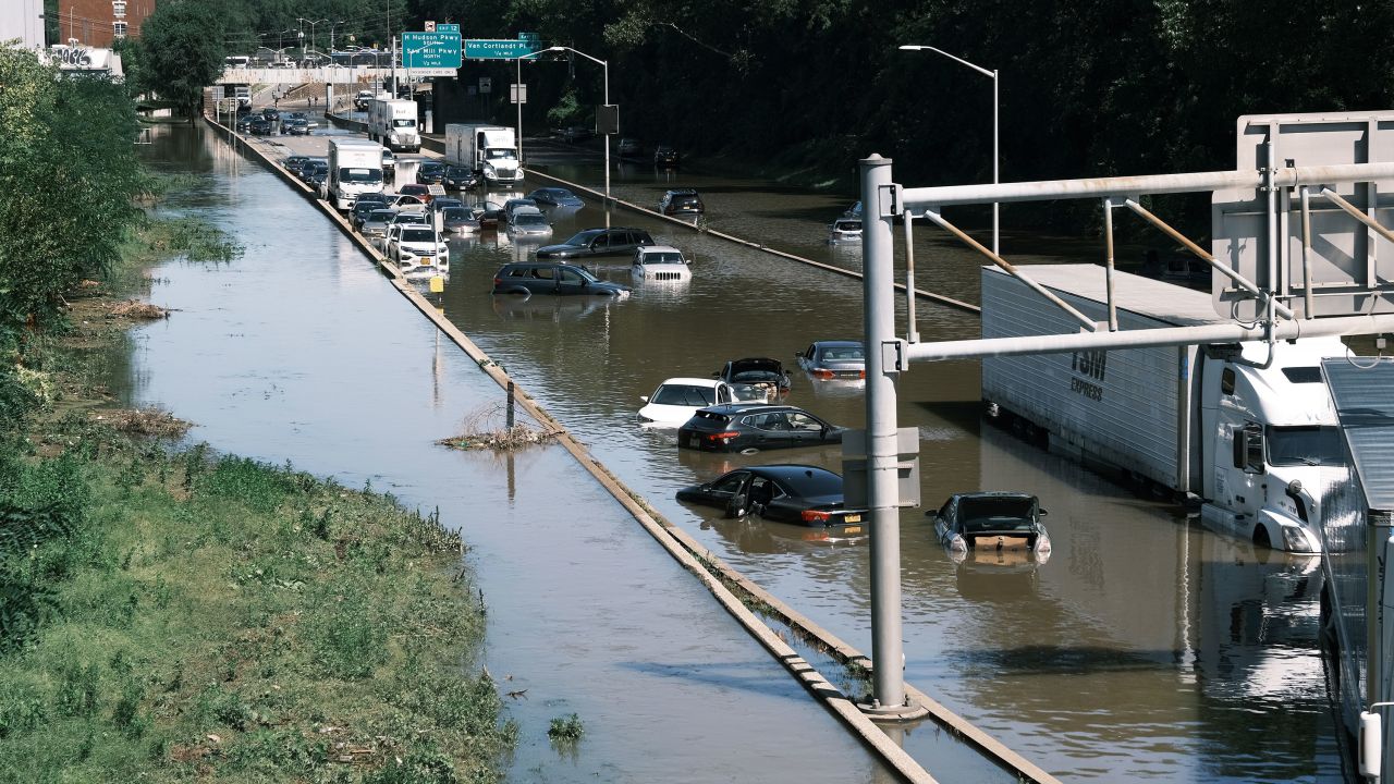 Cars sit abandoned on the flooded Major Deegan Expressway in the Bronx following a night of heavy rain from the remnants of Hurricane Ida in September 2021 in New York City. 