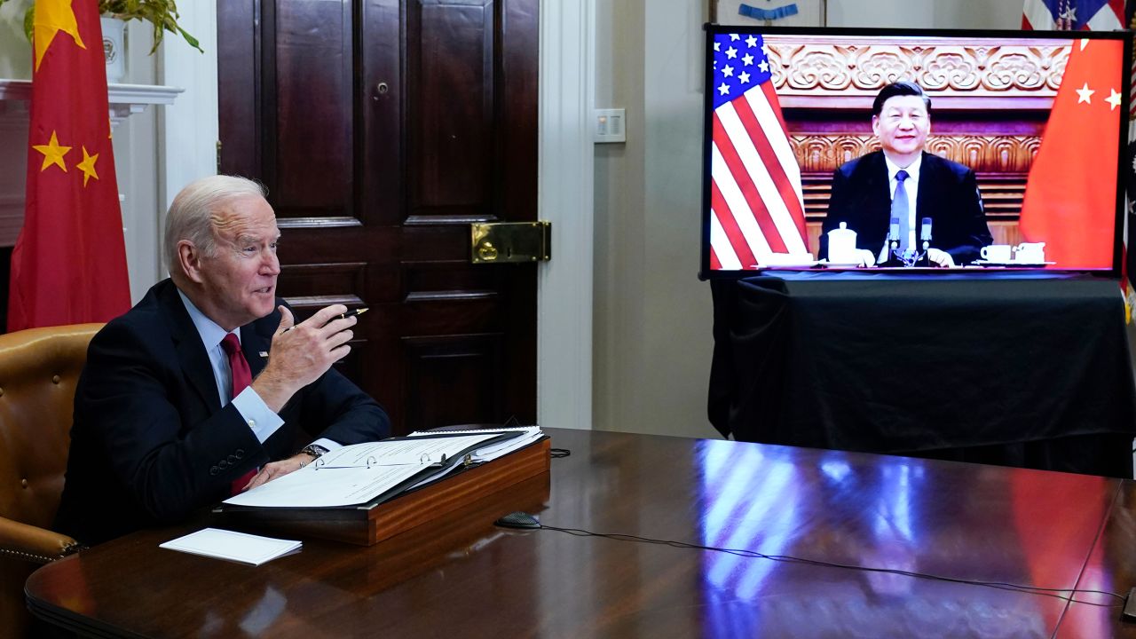 President Joe Biden meets virtually with Chinese President Xi Jinping from the Roosevelt Room of the White House in Washington, Monday, Nov. 15, 2021. (AP Photo/Susan Walsh)