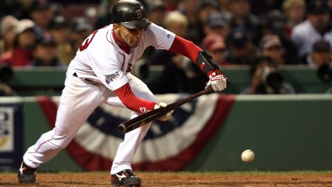 Julio Lugo lays down a bunt against the Colorado Rockies during Game Two of the 2007 World Series at Fenway Park on October 25, 2007.