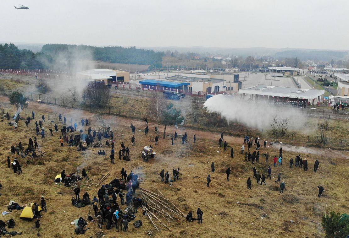 Smoke risis over the border, where thousands of migrants have gathered.