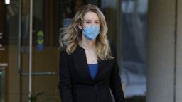 Theranos founder Elizabeth Holmes leaves the Robert F. Peckham Federal Building and U.S. Courthouse in San Jose, Calif., on Wednesday, Sept. 22, 2021. Holmes is charged with two counts of conspiracy to commit wire fraud and nine counts of wire fraud and could face up to 20 years in prison if convicted. 