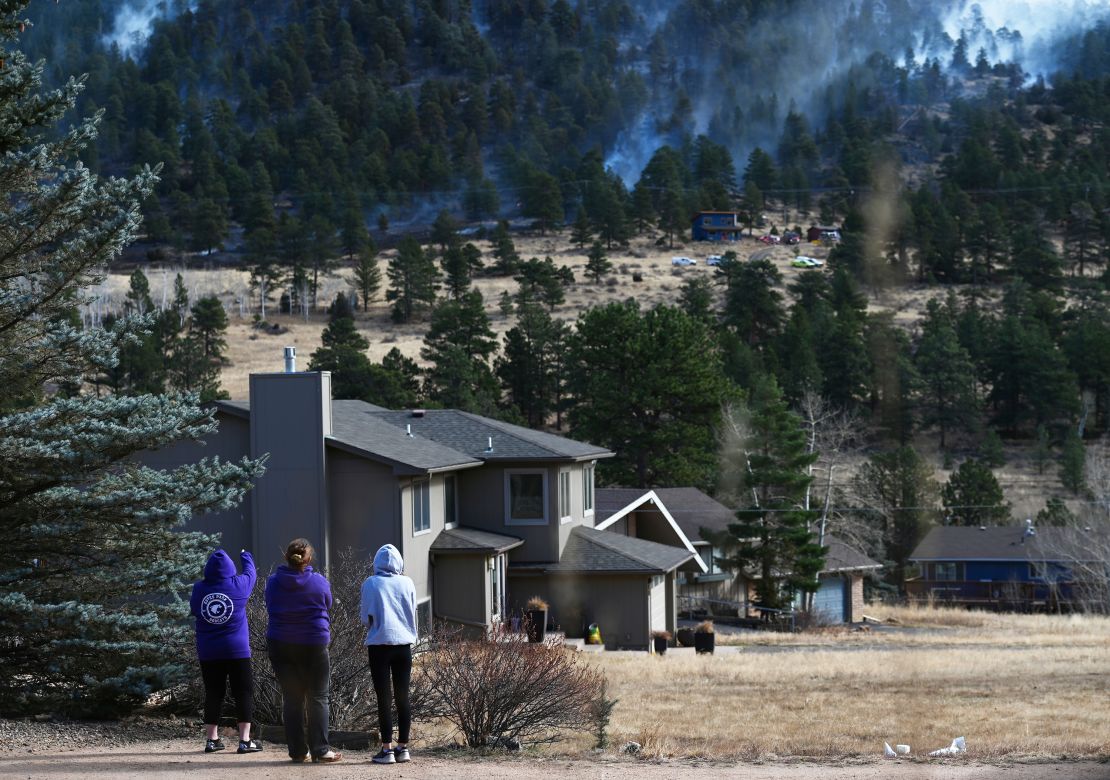 Residents watch as the Kruger Rock Fire burns in Estes Park, Colorado. 