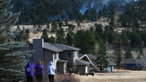 Residents watch as the Kruger Rock Fire burns in Estes Park, Colorado.