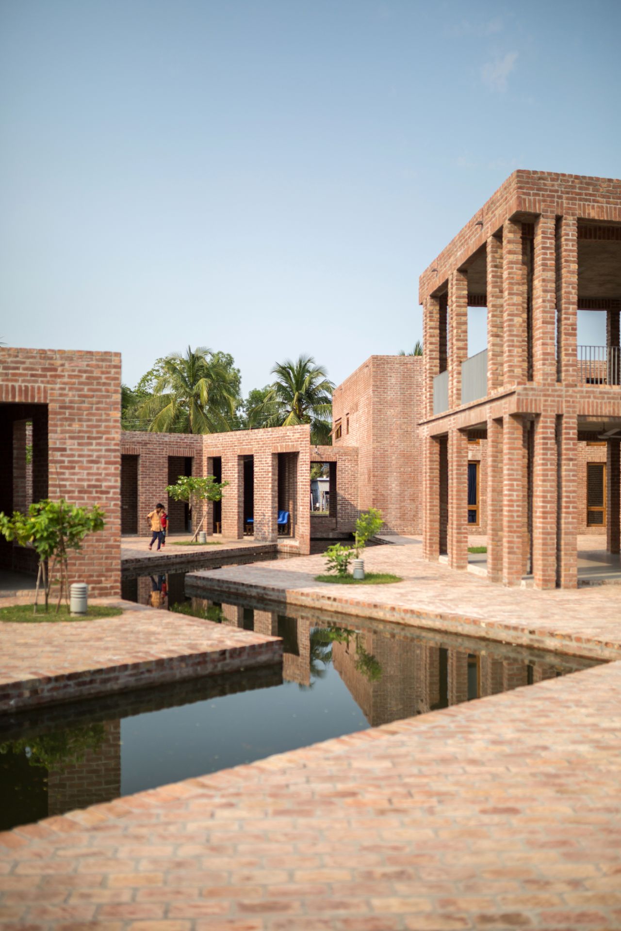 The Friendship Hospital, also pictured top, was constructed using low-cost locally made bricks.
