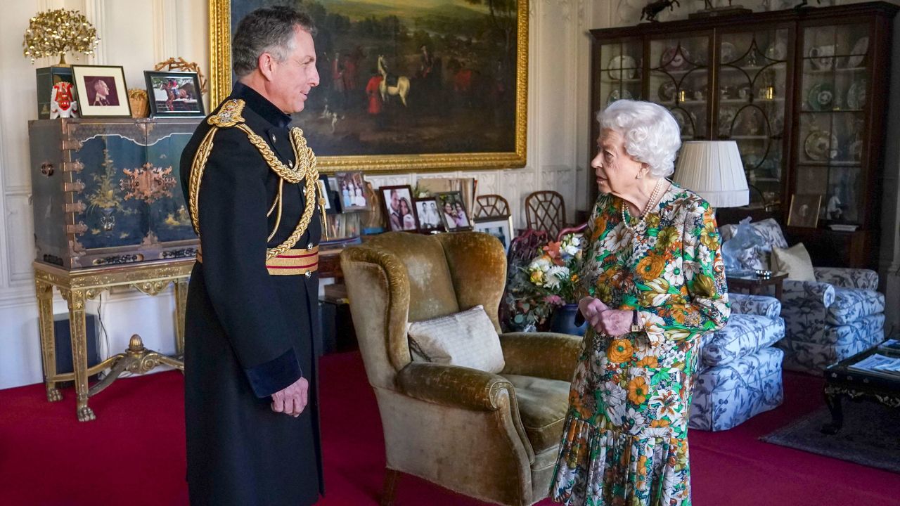 Queen Elizabeth II receives General Sir Nick Carter, Chief of the Defense Staff, left, during an audience in the Oak Room at Windsor Castle, Berkshire, Wednesday Nov. 17, 2021. General Sir Nick is relinquishing his role as the Chief of Defense Staff at the end of this month. (Steve Parsons/Pool Photo via AP)