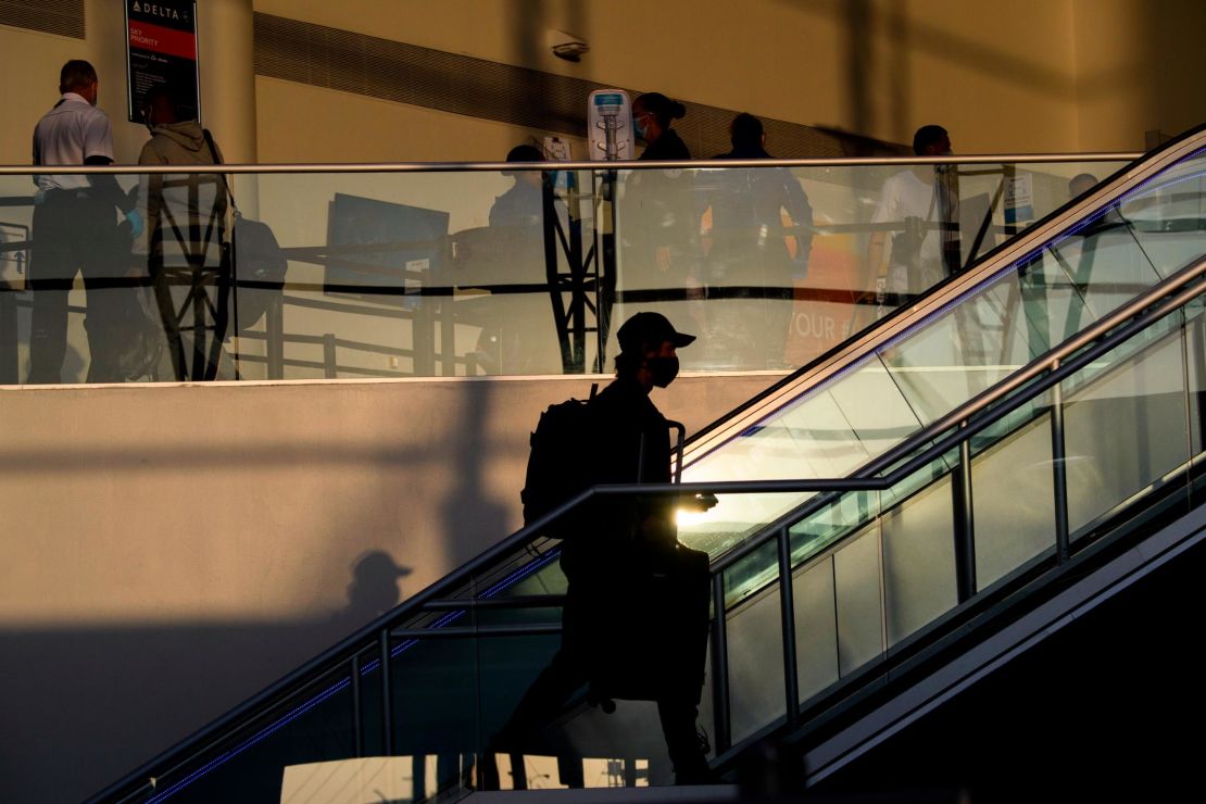 Passengers make their way through Los Angeles International Airport ahead of the Thanksgiving holiday on November 25, 2020.