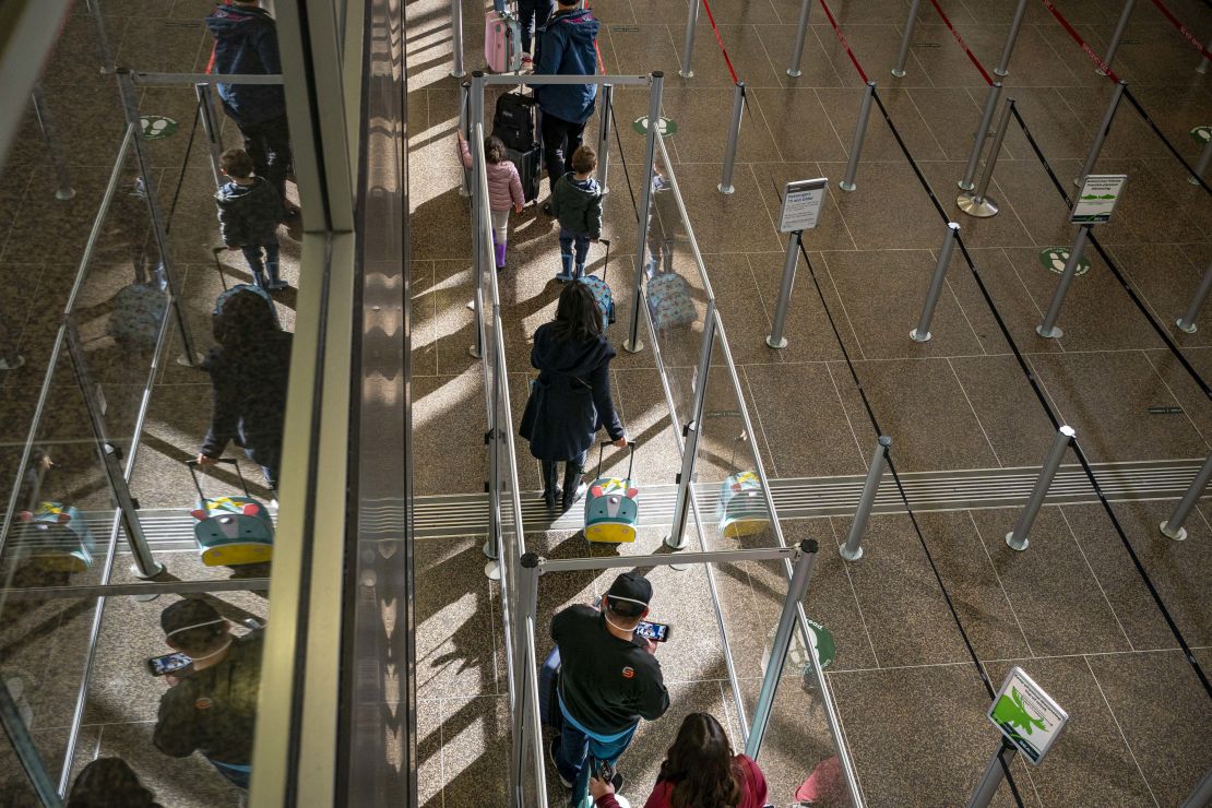 Travelers wait in line at Seattle-Tacoma International Airport last November. This year, Thanksgiving air travel will be close to pre-pandemic levels.