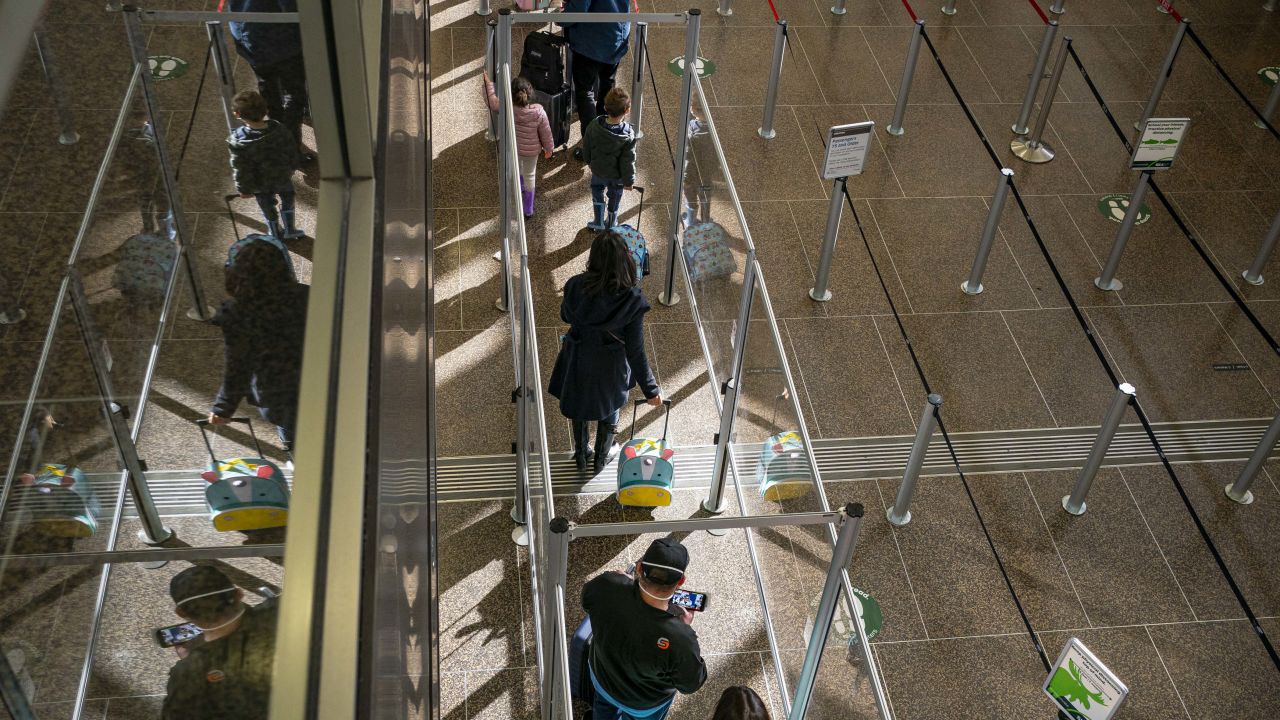 Travelers wait in line at Seattle-Tacoma International Airport last November. This year, Thanksgiving air travel will be close to pre-pandemic levels.
