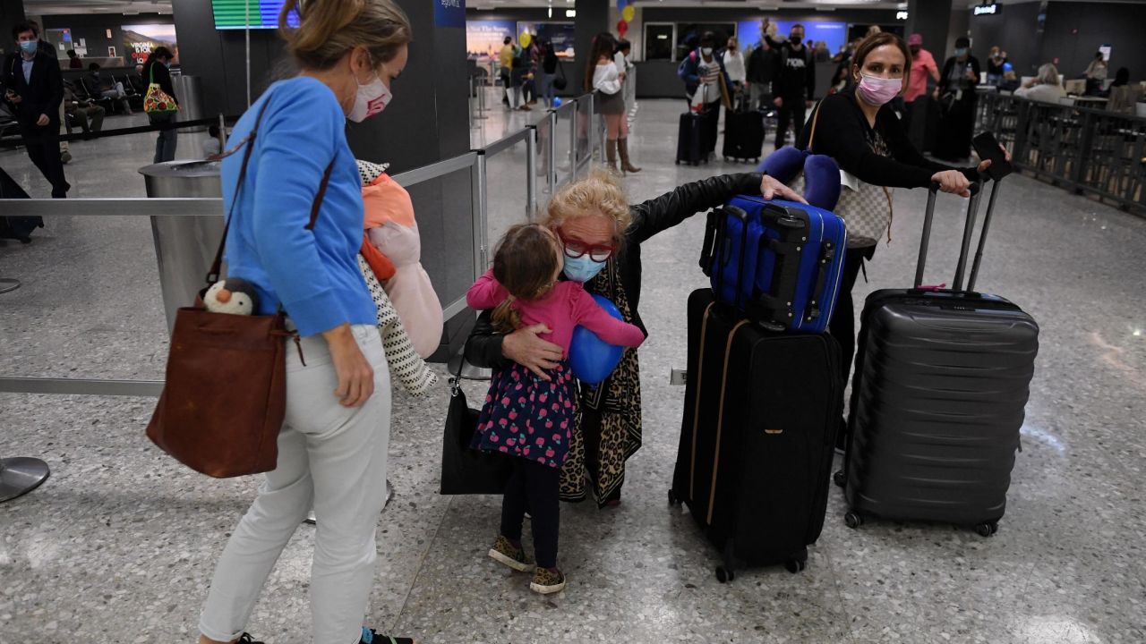 Families reunited at Dulles International Airport on November 8, 2021, when the US reopened to vaccinated international travelers. 