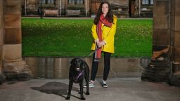 Researcher and DogPhone inventor Ilyena Hirskyj-Douglas with her pet black Labrador, Zach. 