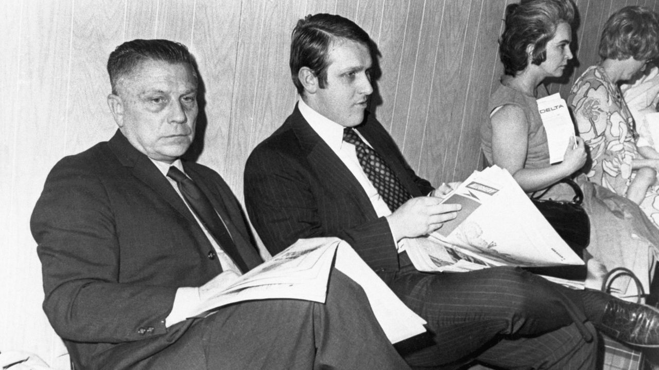 Jimmy Hoffa, left, in the waiting area at Pittsburgh Airport in this 1971 file photo, with his son James Hoffa seated next to him. Jimmy Hoffa was enroute to the federal prison at Lewisburg, Pennsylvania when the photo was taken.