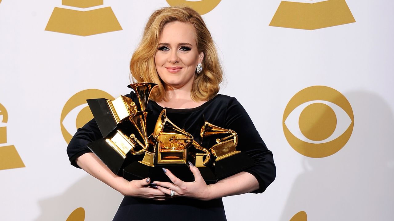 Adele carries her multitude of awards at the 54th Annual Grammys at Staples Center in LA, February 12, 2012.