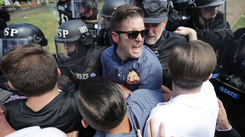 CHARLOTTESVILLE, VA - AUGUST 12:  White nationalist Richard Spencer (C) and his supporters clash with Virginia State Police in Emancipation Park after the "Unite the Right" rally was declared an unlawful gathering August 12, 2017 in Charlottesville, Virginia. Hundreds of white nationalists, neo-Nazis and members of the "alt-right" clashed with anti-fascist protesters and police as they attempted to hold a rally in Emancipation Park, where a statue of Confederate General Robert E. Lee is slated to be removed. (Photo by Chip Somodevilla/Getty Images)