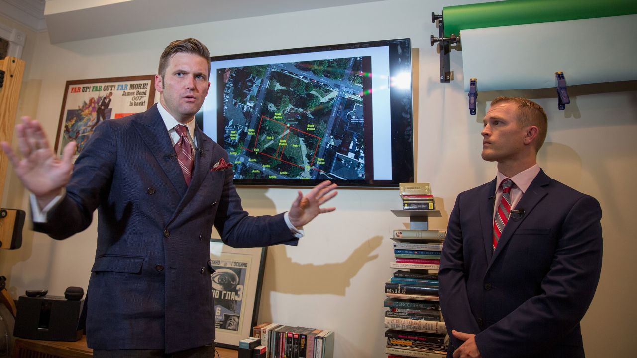 White nationalist Richard Spencer, left, and Nathan Damigo of Identity Evropa speak to select media in a building serving as office space on August 14, 2017, in Alexandria, Virginia. 