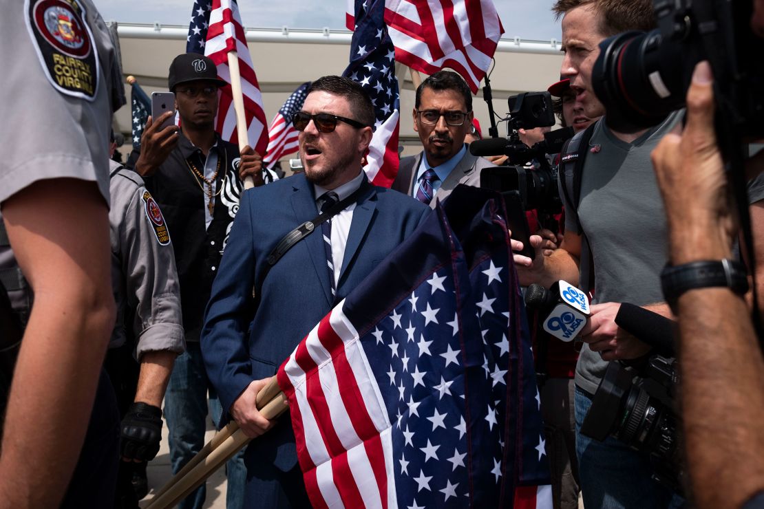 Jason Kessler, the organizer of the Unite the Right rally, is interviewed by reporters on August 12, 2018, in Washington, DC. 