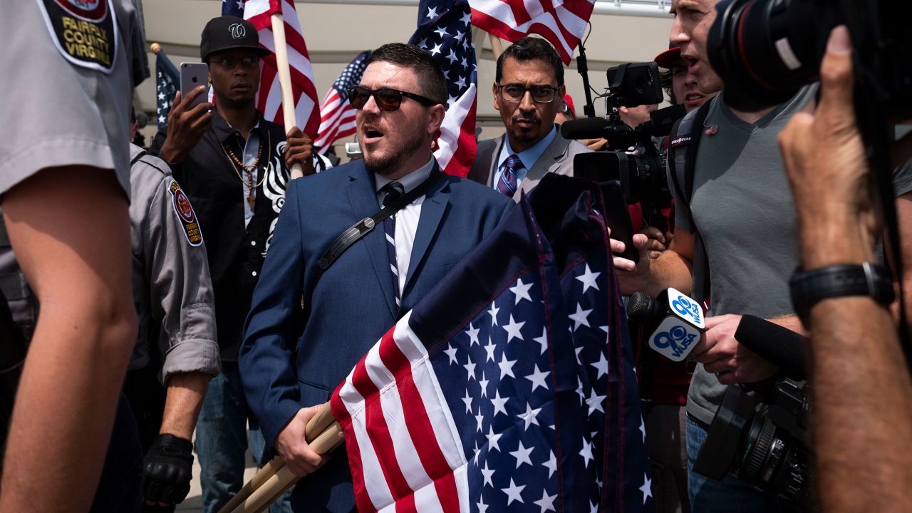 Jason Kessler, the organizer of the Unite the Right rally, is interviewed by reporters on August 12, 2018, in Washington, DC. 