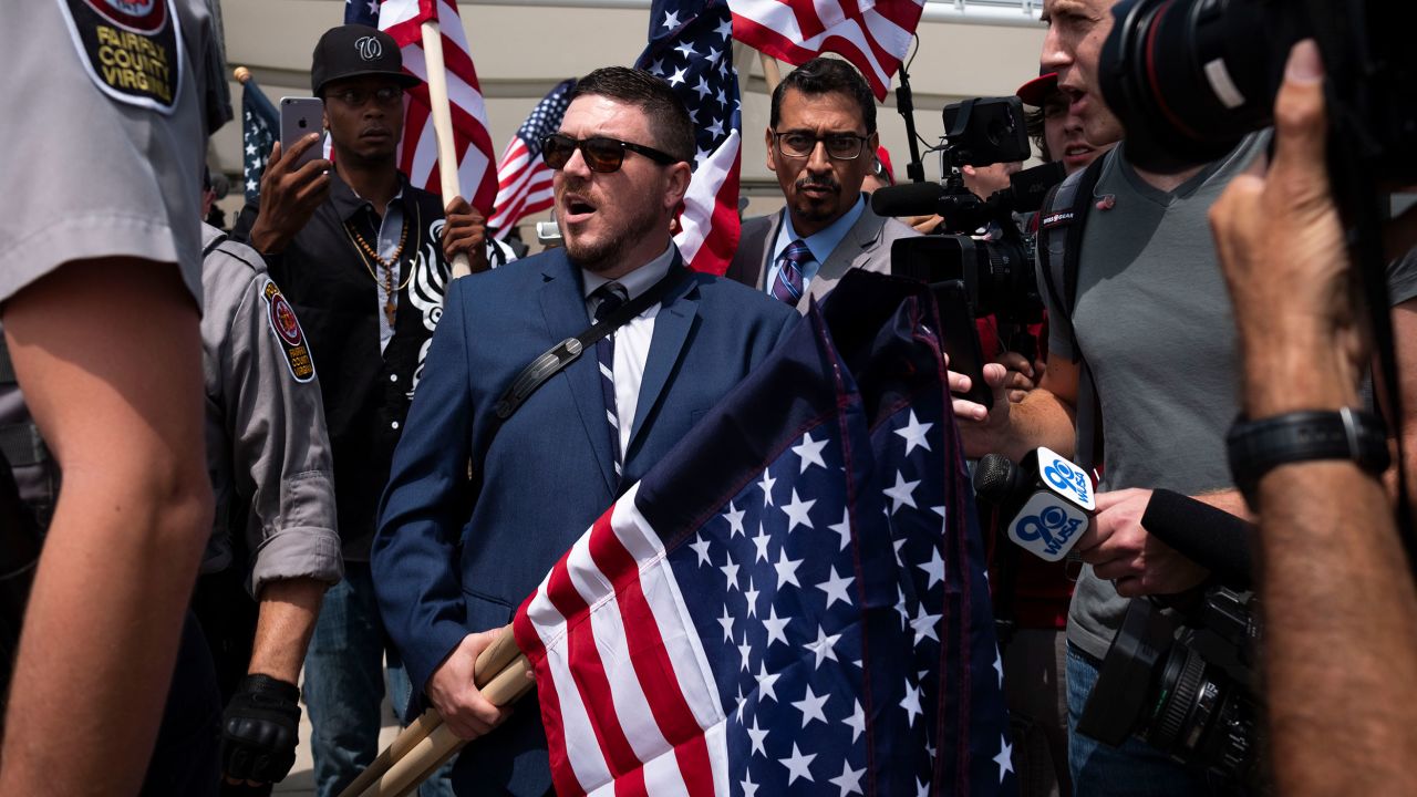 Jason Kessler, the organizer of the Unite the Right rally, is interviewed by reporters on August 12, 2018, in Washington, DC.