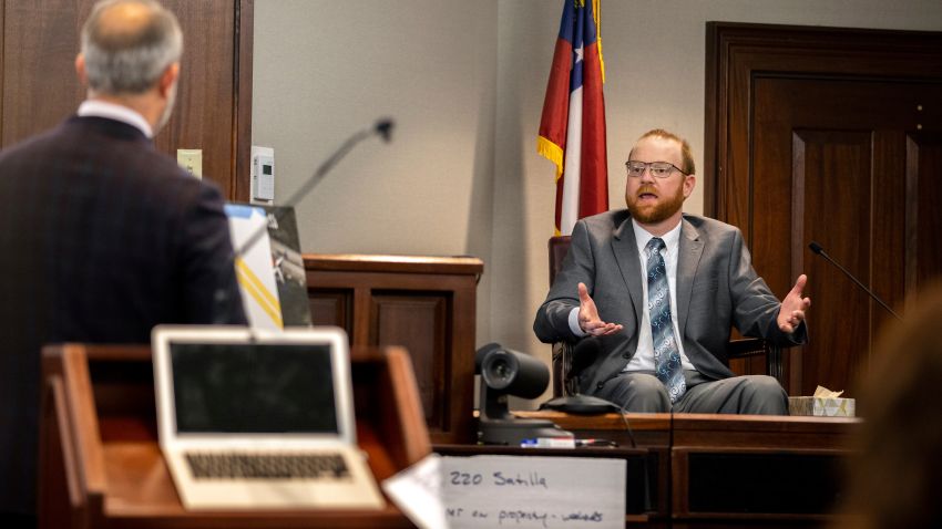 Travis McMichael speaks from the witness stand during his trial Wednesday, Nov. 17, 2021, in Brunswick, Ga. McMichael, his father Greg McMichael and their neighbor, William "Roddie" Bryan, are charged with the February 2020 death of 25-year-old Ahmaud Arbery. (AP Photo/Stephen B. Morton, Pool)