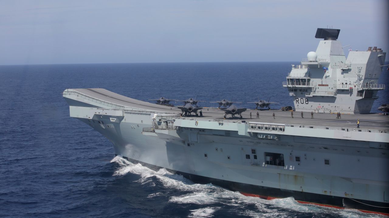 The aircraft carrier HMS Queen Elizabeth, with F-35 fighter jets on its deck, participates in the NATO Steadfast Defender 2021 exercise off the coast of Portugal, May 27, 2021. 