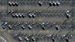 In an aerial view, brand new Ford cars sit in nearly empty storage lot at Auto Warehouse Co. on November 10, 2021 in Richmond, California. 