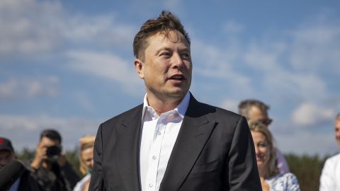 Tesla head Elon Musk talks to the media as he arrives to look at the construction of the Tesla Gigafactory near Berlin on September 3, 2020.