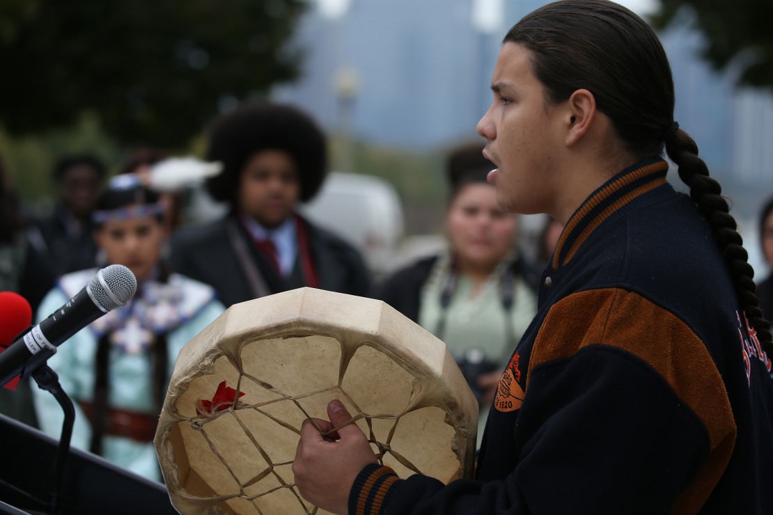 Adrien Pochel, who is Oji-Cree and Lakota, drums and sings during a land acknowledgement ceremony for Chicago's Field Museum on October 26, 2018.