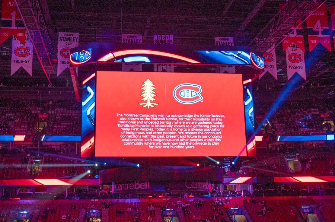 An NHL game between the Montreal Canadiens and San Jose Sharks opens with a land acknowledgment shown on the scoreboard.