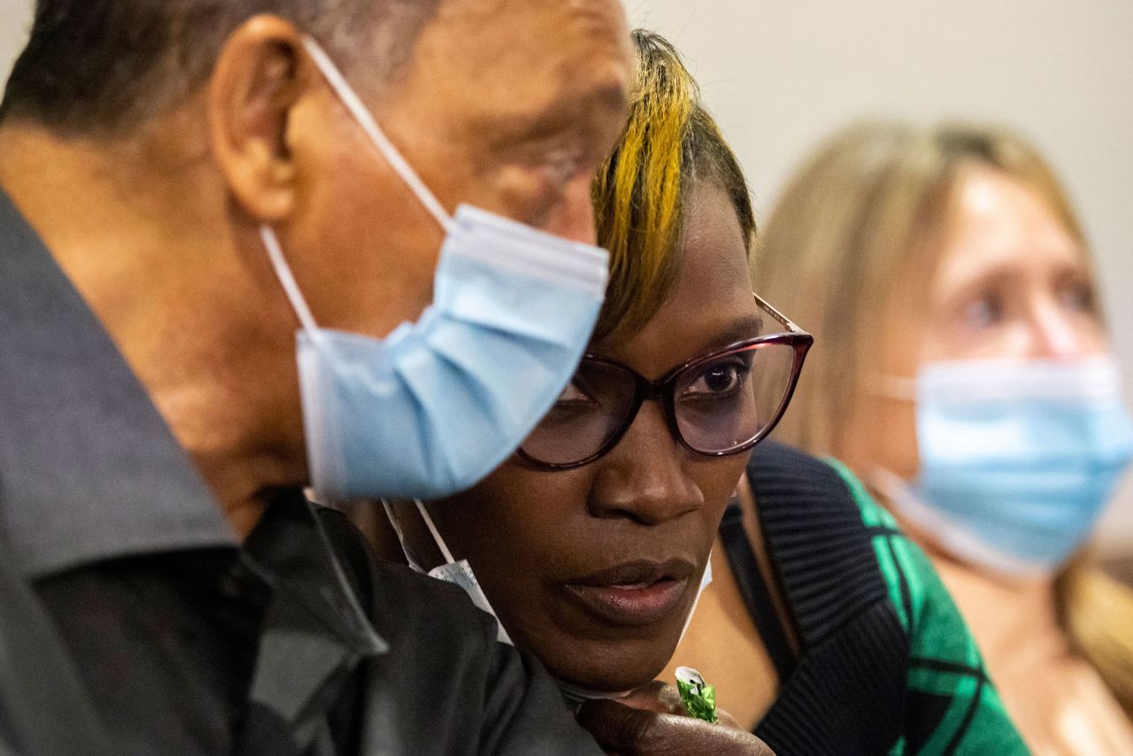 The Rev. Jesse Jackson, left, speaks with Ahmaud Arbery's mother, Wanda Cooper-Jones, inside a courtroom in Brunswick, Georgia, on Monday, November 15. Jackson has been <a href="https://www.cnn.com/2021/11/15/us/jesse-jackson-at-arbery-death-trial/index.html" target="_blank">attending the trial</a> of the three men charged with killing Arbery last year. Defense attorney Kevin Gough tried to have Jackson removed from court on Monday, saying that Jackson's presence could influence the jury. The judge denied Gough's request.
