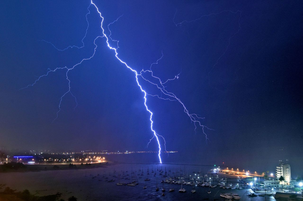 A lightning bolt strikes near the Uruguayan Yacht Club during a thunderstorm in Montevideo early on Tuesday, November 16.