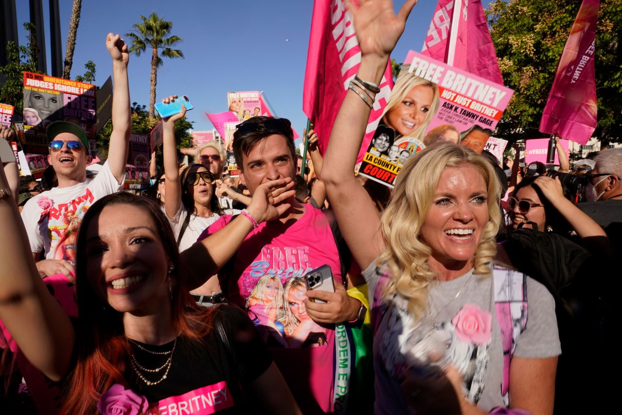 Supporters of pop star <a href="https://www.cnn.com/2021/02/09/entertainment/gallery/britney-spears/index.html" target="_blank">Britney Spears</a> celebrate outside a Los Angeles courthouse on Friday, November 12, after a judge <a href="https://www.cnn.com/2021/11/12/entertainment/britney-spears-conservatorship-ends/index.html" target="_blank">terminated the conservatorship</a> that had controlled her life for over a decade. Spears' father, Jamie, served as her conservator for 13 years, but he unexpectedly filed a petition in September to end the arrangement.