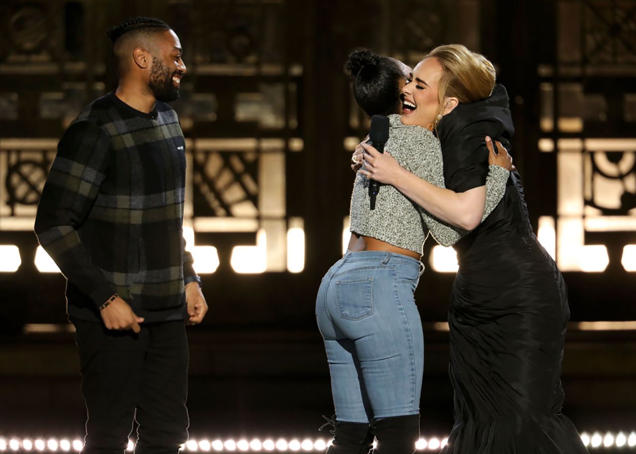 Singer Adele hugs Ashleigh Mann after Mann's boyfriend, Quentin Brunson, <a href="https://www.cnn.com/2021/11/14/entertainment/adele-one-night-only-oprah-highlights/index.html" target="_blank">proposed to her on stage</a> during Adele's "One Night Only" special that aired on Sunday, November 14. Mann was brought out to the stage with a blindfold and noise-canceling headphones. After the proposal, Adele sang "Make You Feel My Love."