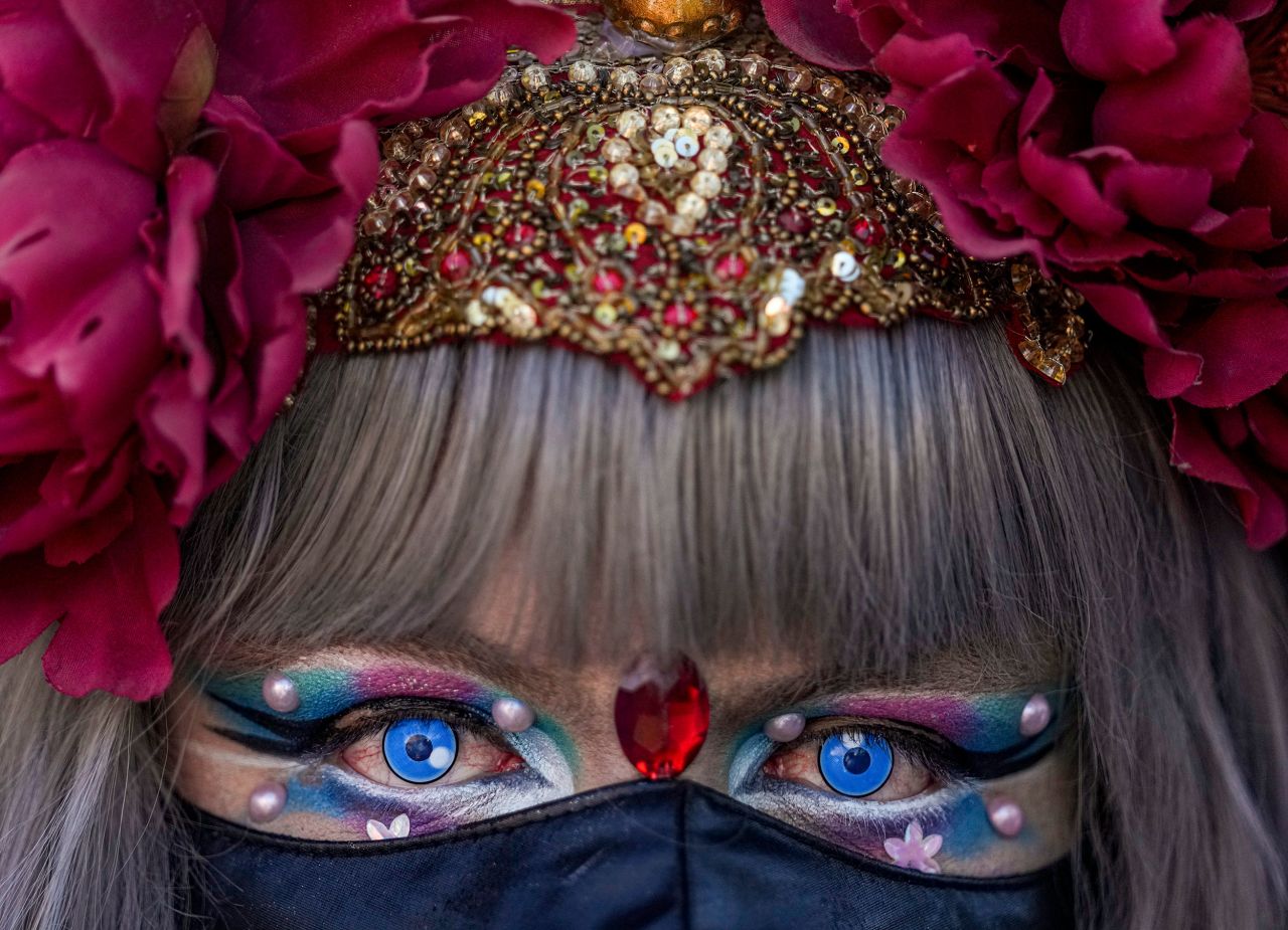 A participant eyes the camera during the annual Gay Pride parade in Santiago, Chile, on Saturday, November 13.