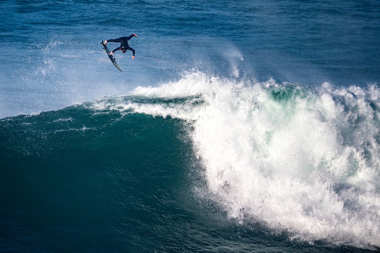 Big-wave surfer Pierre Rollet goes airborne during a session in Nazare, Portugal, on Monday, November 15.
