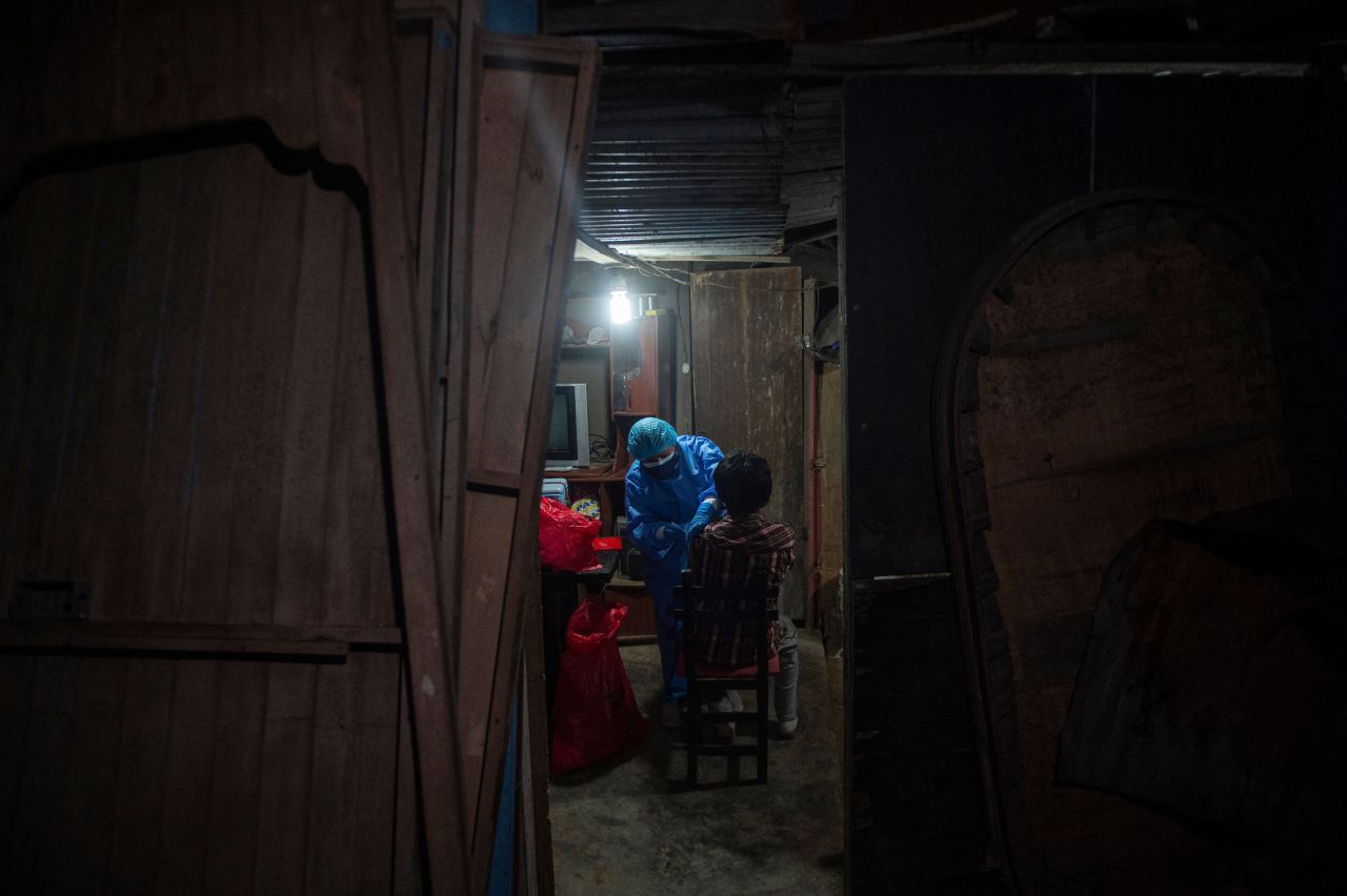 A health worker administers a Covid-19 vaccine in Lima. Peru, on Monday, November 15.