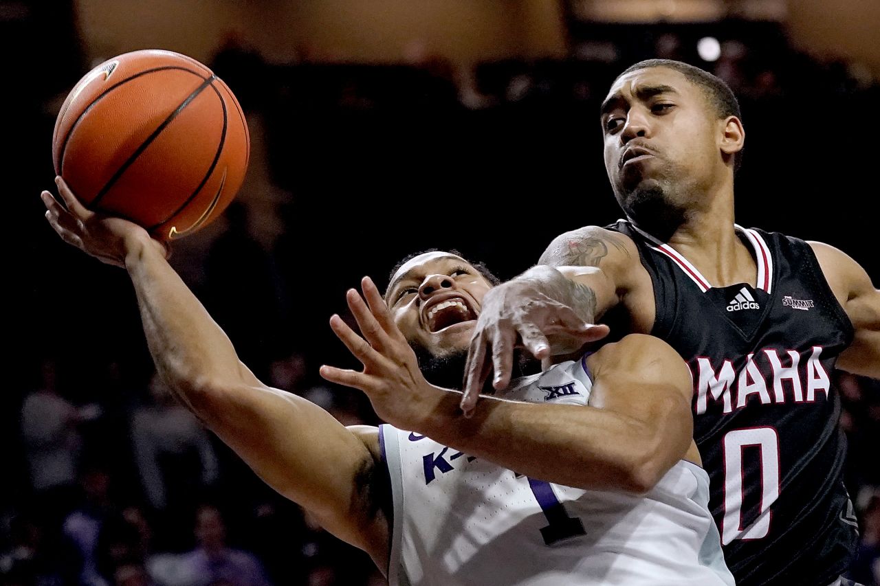 Kansas State's Markquis Nowell is defended by Omaha's Sam'i Roe during a college basketball game in Manhattan, Kansas, on Wednesday, November 17.