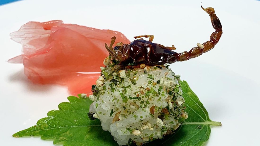 "What I'm trying to do, is be able to present people with this wonderful cornucopia of flavors, textures, and ideas of how to cook with edible insects," says Yoon. Pictured, Yoon's Manchurian scorpion sesame rice ball.<br />