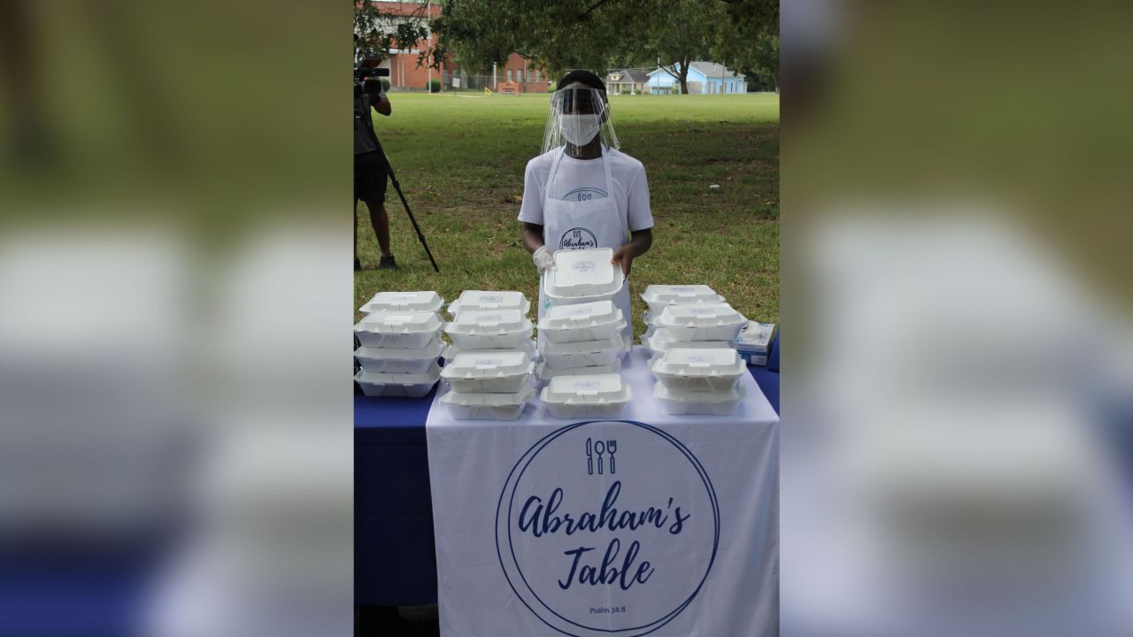 Abraham stands in front of "Abraham's Table," his Make-A-Wish service to feed the homeless in Jackson, Mississippi.