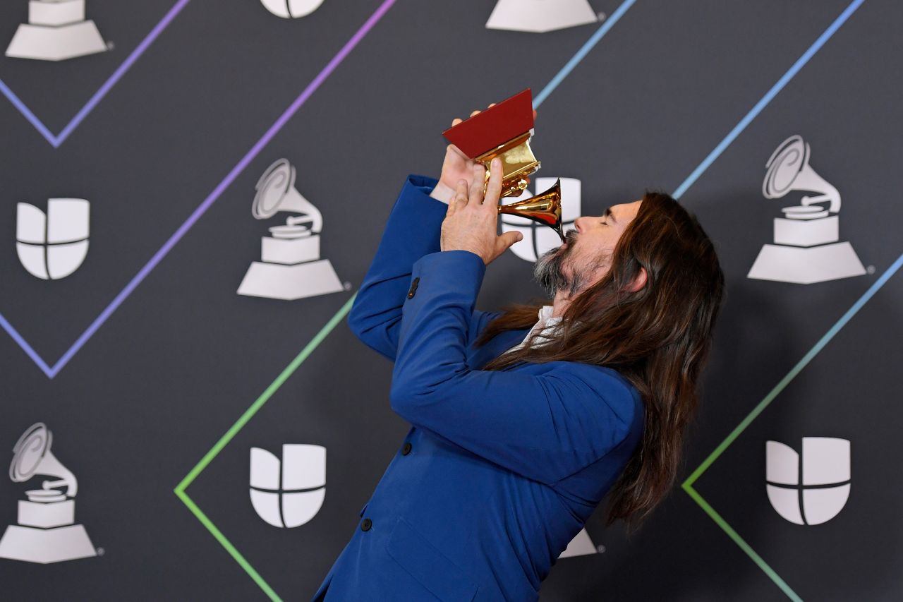 Juanes poses with his Best Pop/Rock Album award.